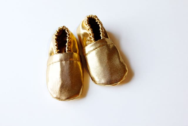gold baby shoes see kate sew
