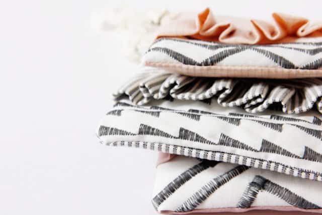 ruffle zip pouches with decorative stitching