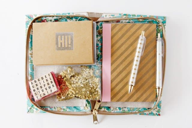 book clutch with stationary supplies