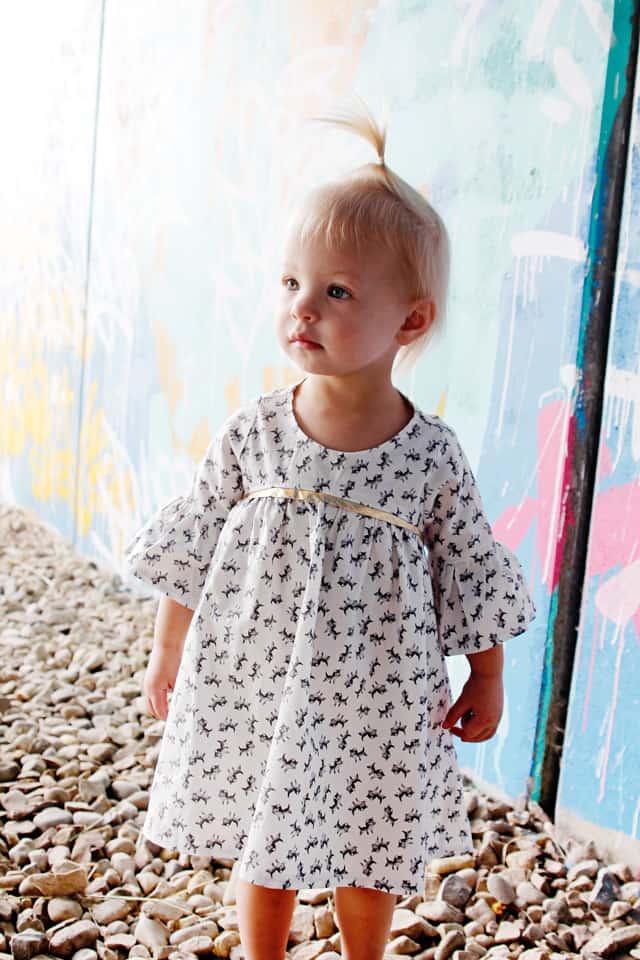 Add Gold Sparkle to a Dress! | DIY Girls Dresses | DIY Girls Dresses with Gold Sparkle | Emma Dress Pattern | Riley Blake Fabric Tour | Petite Treat Cat Dress | How to Sew Girls Dresses | Girls Dress Pattern | How to Add Bias Tape to a Dress || See Kate Sew #girlsdresses #diygirlsdresses #diykidsclothes #rileyblake #petitetreat #biastape #goldsparkle #seekatesew