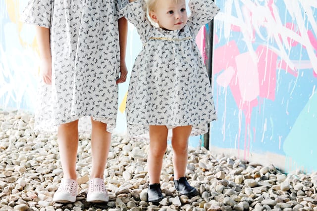 Add Gold Sparkle to a Dress! | DIY Girls Dresses | DIY Girls Dresses with Gold Sparkle | Emma Dress Pattern | Riley Blake Fabric Tour | Petite Treat Cat Dress | How to Sew Girls Dresses | Girls Dress Pattern | How to Add Bias Tape to a Dress || See Kate Sew #girlsdresses #diygirlsdresses #diykidsclothes #rileyblake #petitetreat #biastape #goldsparkle #seekatesew