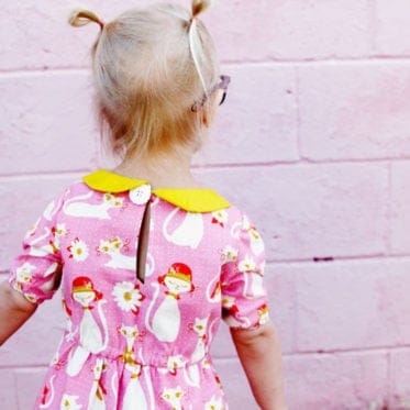 The Olivia Dress sewing up in gorgeous quilting cotton with a bright yellow collar to match! Simple lines with a few really cute features! Simple to get on your kiddo, the waistline is elastic and it just slips right on! Plus...Pockets! || See Kate Sew #dresspatterns #kidsfashion #dresses #seekatesew