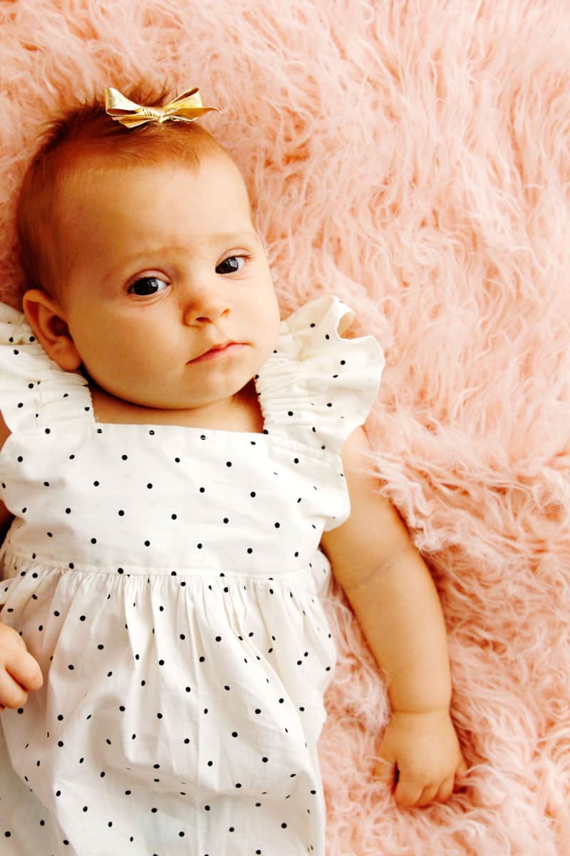 The Easy BABY Dress Pattern is finally here! Not only is this dress easy and fast to sew, with elastic straps as the sleeves, it slips on and off quickly and easily! || See Kate Sew #babydress #babyclothes #diybaby #seekatesew