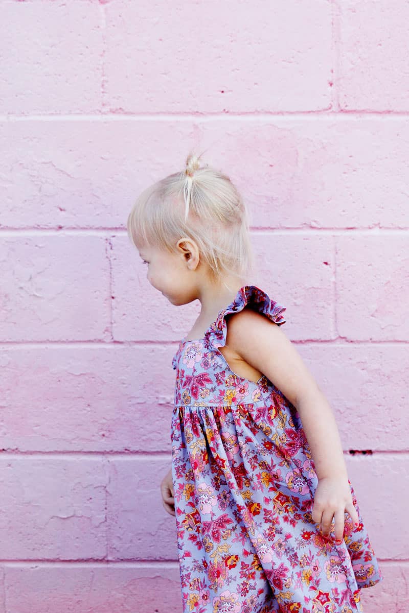 I designed the Easy Summer Dress to use with my favorite quilting cottons but after making it in lightweight lawn, I'm in love! This dress is fun and fast to make! it's perfect for pulling on over a swimsuit and also dries quickly! || See Kate Sew #girlsdresses #dresspattern #rileyblake #girlsfashion #seekatesew