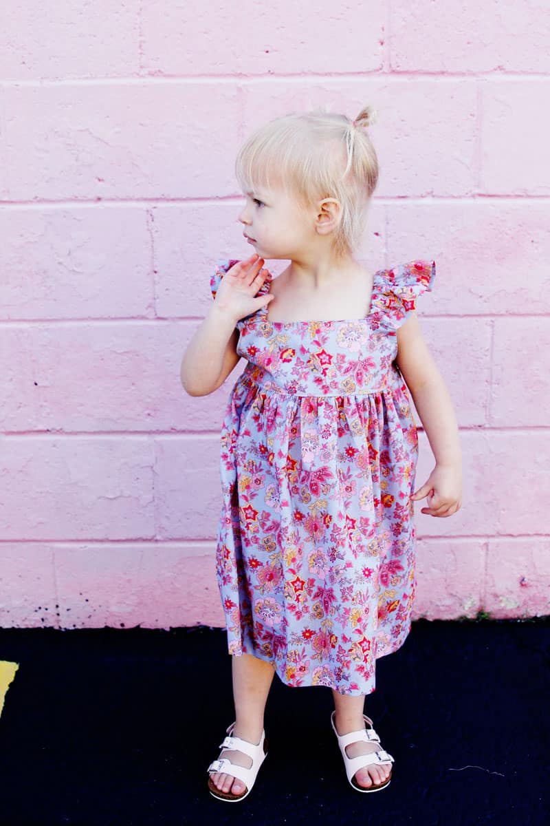 I designed the Easy Summer Dress to use with my favorite quilting cottons but after making it in lightweight lawn, I'm in love! This dress is fun and fast to make! it's perfect for pulling on over a swimsuit and also dries quickly! || See Kate Sew #girlsdresses #dresspattern #rileyblake #girlsfashion #seekatesew