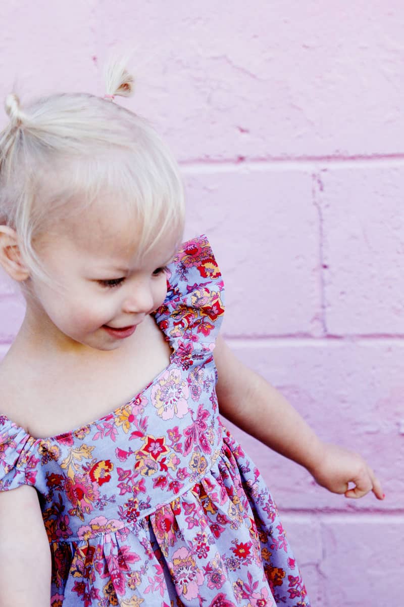 I designed the Easy Summer Dress to use with my favorite quilting cottons but after making it in lightweight lawn, I'm in love! This dress is fun and fast to make! it's perfect for pulling on over a swimsuit and also dries quickly! || See Kate Sew #girlsdresses #dresspattern #rileyblake #girlsfashion #seekatesew