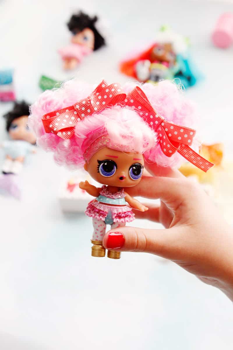 lol doll with white hair and pink bow