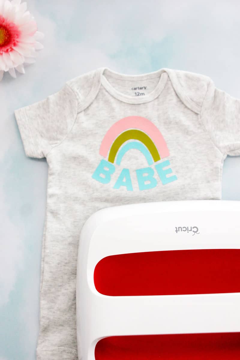 Make this easy Rainbow Baby Onesie with a blank onesie and this free SVG file. Choose a cute onesie with 3 colors of iron-on vinyl and you have a perfect gift for a sweet rainbow baby or your own sweet rainbow babe! || See Kate Sew #rainbowbaby #babyonesies #cricutprojects #freesvg #seekatesew