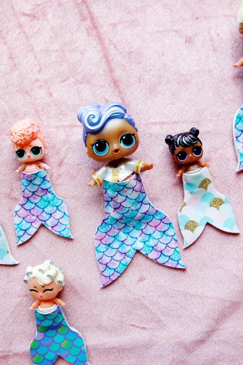 Summertime is for MERMAIDS! This is a super fun craft that is perfect for a summer afternoon! These mermaid tails for dolls are faux leather glued together so they are very fast so your kids can get right to playing! || See Kate Sew #mermaidtails #mermaidcraft #loldollaccessories #dollaccessories #seekatesew