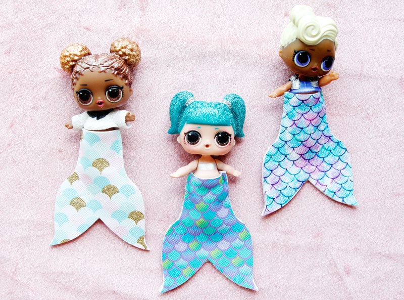 Summertime is for MERMAIDS! This is a super fun craft that is perfect for a summer afternoon! These mermaid tails for dolls are faux leather glued together so they are very fast so your kids can get right to playing! || See Kate Sew #mermaidtails #mermaidcraft #loldollaccessories #dollaccessories #seekatesew