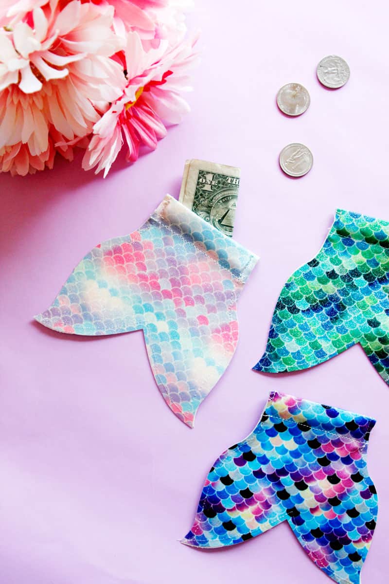 This DIY Mermaid Snap Coin Pouch is easy to open and perfect for stashing coins. It's super fun and easy, and the mermaid tail shape is perfect for your pool bag. || See Kate Sew #coinpouch #mermaidcrafts #freesvg #freetutorial #cricutcrafts