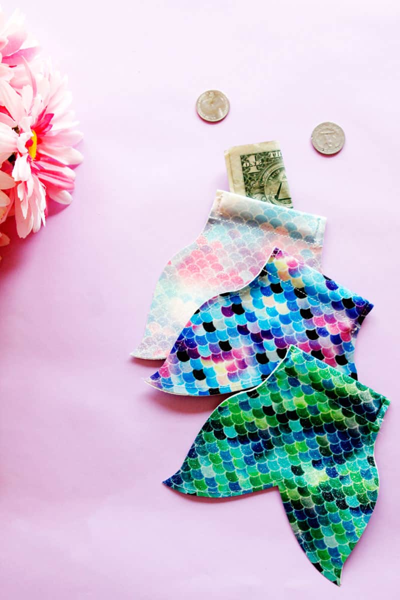 This DIY Mermaid Snap Coin Pouch is easy to open and perfect for stashing coins. It's super fun and easy, and the mermaid tail shape is perfect for your pool bag. || See Kate Sew #coinpouch #mermaidcrafts #freesvg #freetutorial #cricutcrafts