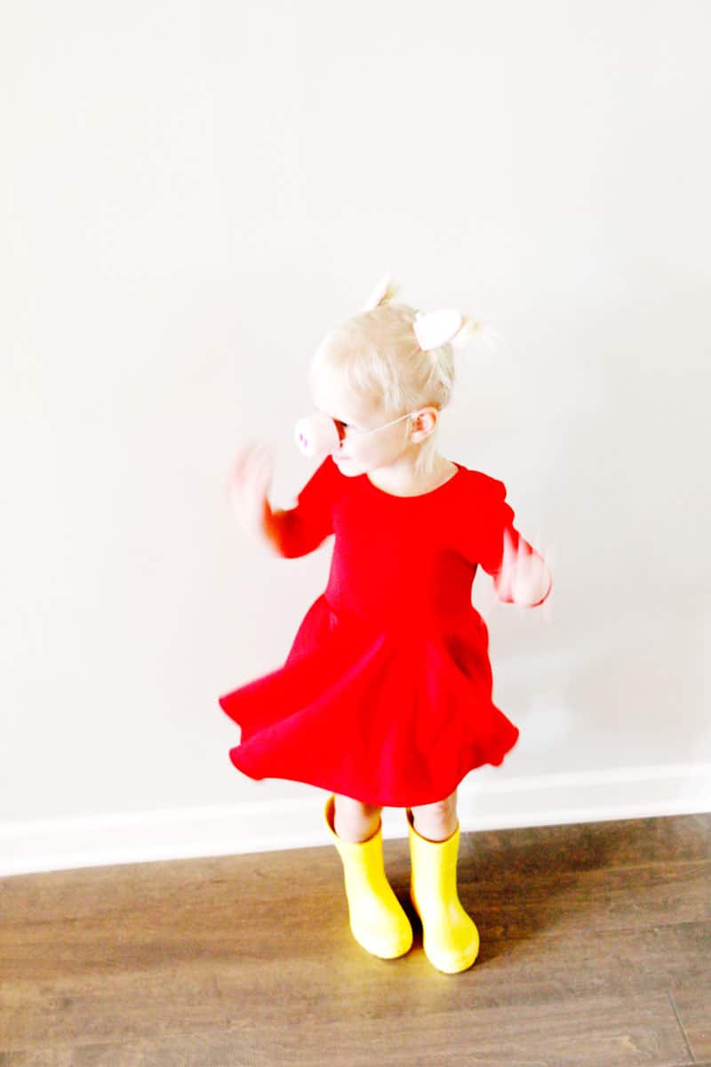 This Peppa Pig costume DIY is perfect for Halloween and dress-ups after! Starting with a basic red dress and add a few little pig accessories, you will love how easy this costume is to make! || See Kate Sew #diycostumes #costumes #diypeppapig #peppapig #diyhalloween #freedownload #seekatesew 