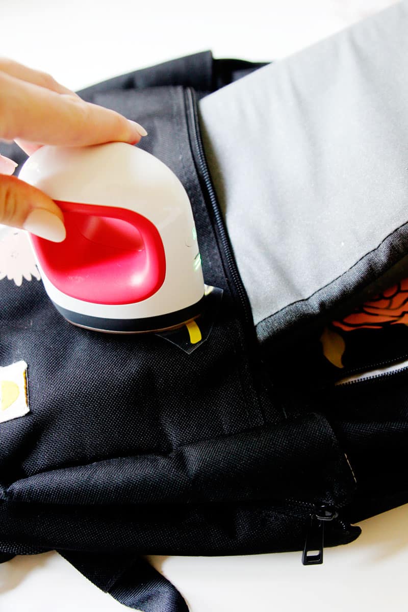 This FREE TUTORIAL on How To Iron-on Vinyl on a Backpack with the Cricut EasyPress 2 Mini will show you how to give an old backpack a revamp! || See Kate Sew #cricutcrafts #cricuttutorial #freetutorial #easypress2 #seekatesew