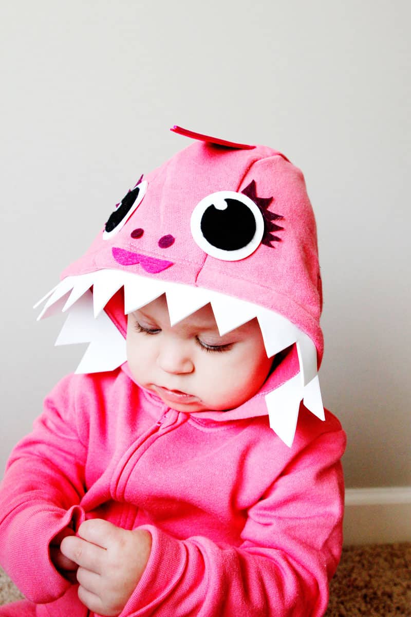 This Pink DIY Baby Shark Costume with a Hoodie is so easy to make! It's the perfect no-sew Halloween costume! || See Kate Sew #babyshark #diyhalloweencostume #babycostume #diycostume #easycostumes #seekatesew