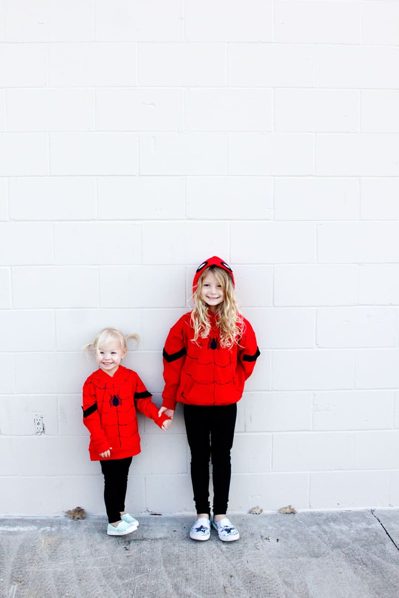 Spider-Man is a great easy costume to make for Halloween! Easy to make using red hoodies and black leggings, these costumes are quick and kid-friendly. || See Kate Sew #diyhalloween #diycostumes #spidermancostumes #spiderman #seekatesew